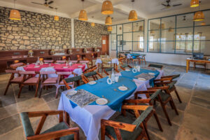 Elegant indoor dining area with rustic décor and wooden seating